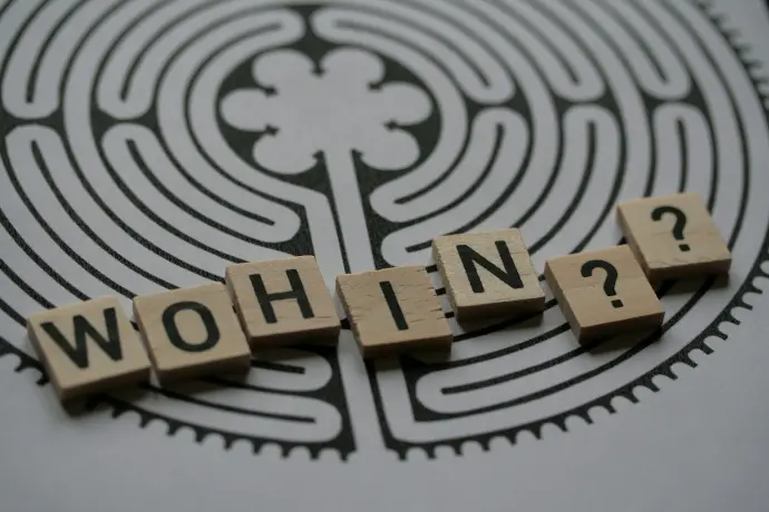 a close up of scrabble tiles with words saying who's in?